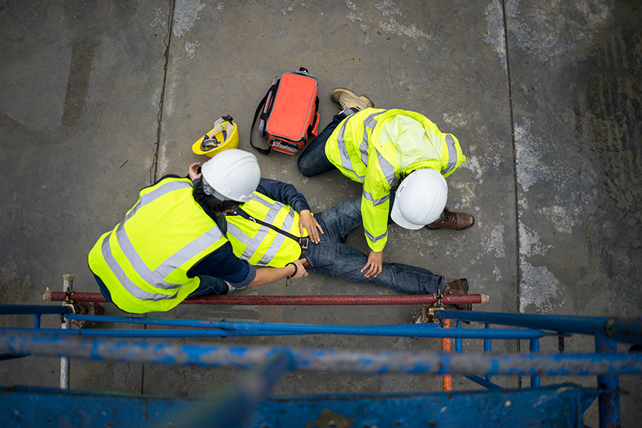 Emergency First Responders tending to an injured worker